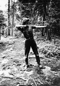 Frances practices archery below the fire tower.