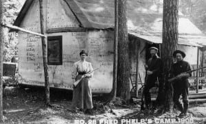 Fred Phelps, center, poses in 1908 with two companions outside his hunting cabin near Cranberry Lake.