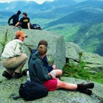 Summit stewards teach hikers about alpine flora.