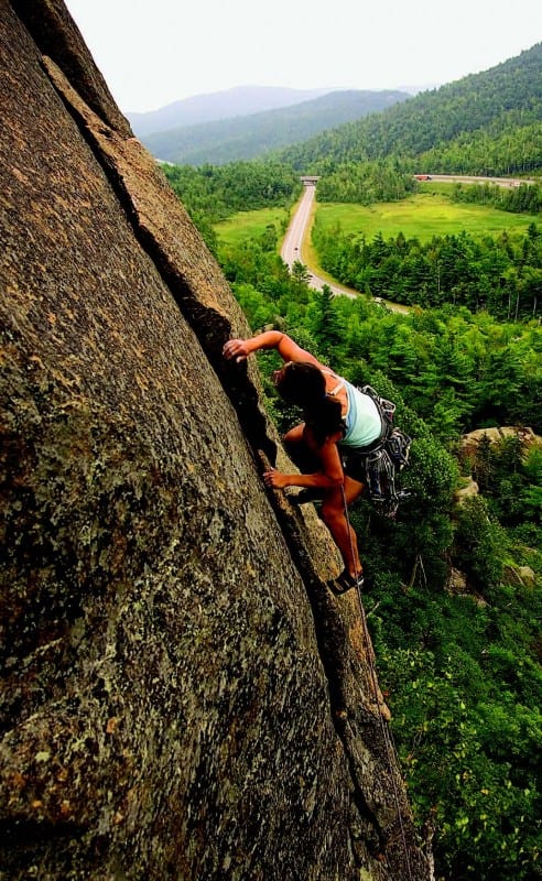 Sarah Councell climbs Freedom Flight (5.10a), on Poke-O Moonshine.