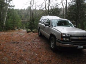 truck at pond web A truck parked at the Crane Pond Road, nearly two miles inside the Pharaoh Lake Wilderness. Photo by Phil Brown.