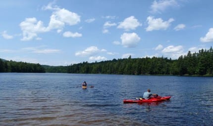 canoe area Kayakers in the motor-free St. Regis Canoe Area. Photo by Phil Brown.
