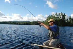 Jack Ballard casts for bass on Forked Lake. Photo by Lisa Densmore