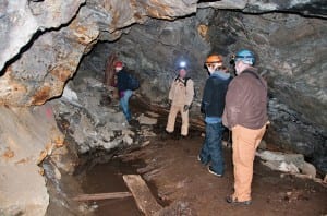 State scientists explore one of the corridors in the abandoned mine. Photo by Carl Heilman II