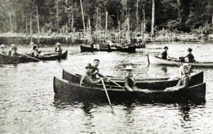 Local guides row tourists on the Fulton Chain of Lakes.