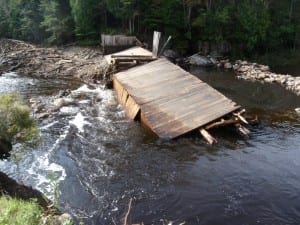 Duck Hole is draining around the failed dam. Photo by Phil Brown.