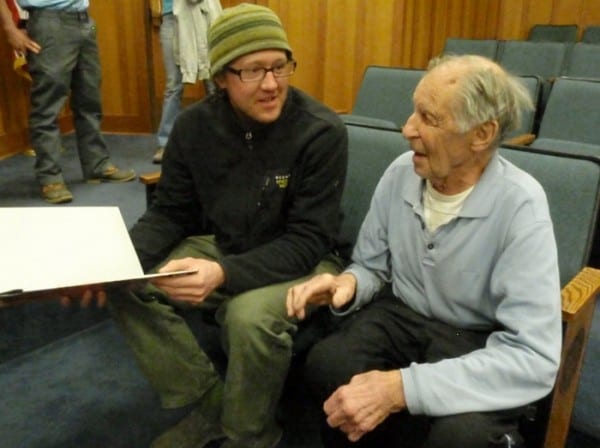 Local climber Will Roth chats with Fred Beckey at Northwood School in Lake Placid Monday night. Photo by Phil Brown.