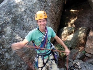     Colin flakes the rope before his climb with the author. Photo by Phil Brown