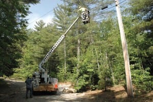 A crew strings fiber-optic cable in Keene Valley in 2009. Photo by Susan Bibeau