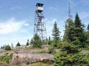 An abandoned fire tower still stands sentinel on St. Regis Mountain part of the saranac lake 6ers