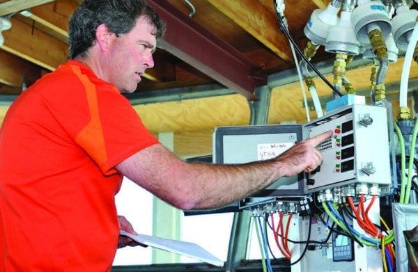 Paul Casson calibrates equipment in the research station atop Whiteface Mountain. Photo by Pat Hendrick