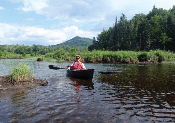 A canoeist explores the mouth of the Goodnow River, a tributary of the Hudson. Photo by Phil Brown