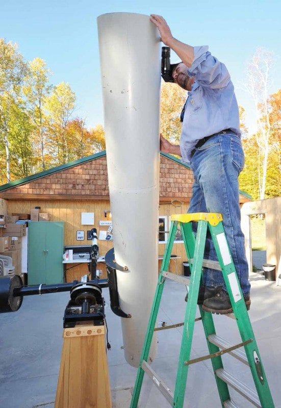 Marc Staves inspects a telescope outside the Adirondack Public Observatory in Tupper Lake. Photos by Pat Hendrick