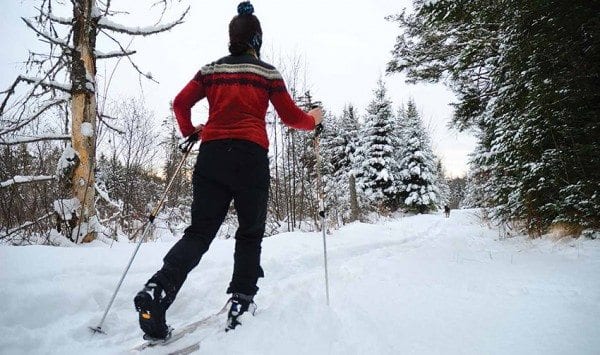 Sue Bibeau, and her dog, Ella, enjoy a powder day on the trail to High Rock in mid-December. Photo by Sue Bibeau