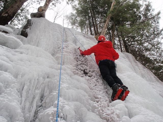 Dan Plumley climbs a route at Dipper Brook. Photo by Phil Brown.