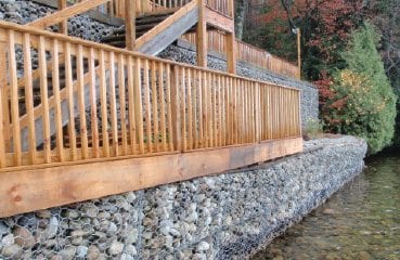 A riprap wall interrupts the natural shoreline. COURTESY OF THE FUND FOR LAKE GEORGE