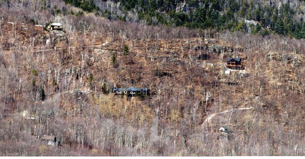 Vacation homes and access roads scar a steep mountainside above Keene Valley.  PHOTO BY GEORGE EARL