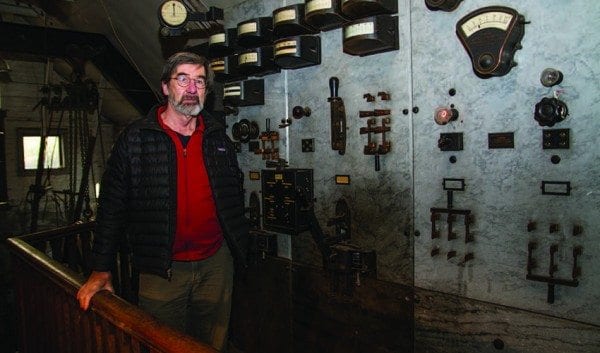 Matt Folley uses a vintage control panel to run his hydroelectric plant. Photo by Seth Lang