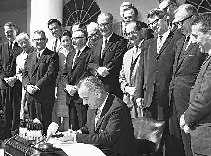 President Lyndon Johnson signs the Wilderness Act in 1964. Courtesy of the National Park Service