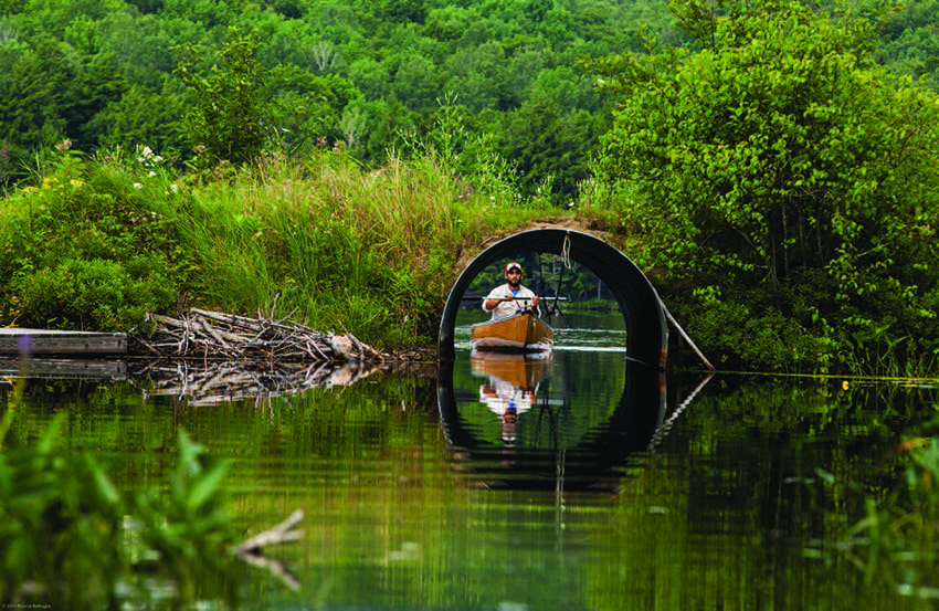Paddlers must pass through a culvert when traveling between Fourth and Fifth lakes. Photo by Nancie Battaglia