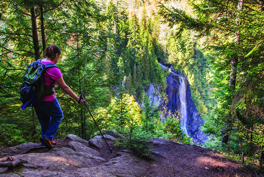 A hiker arrives at the lookout for OK Slip Falls. Photo by Nancie Battaglia