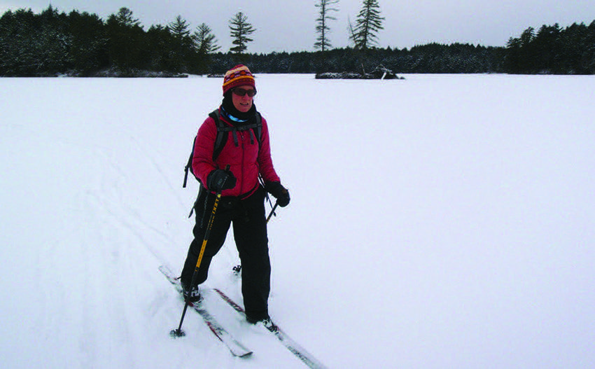 Carol MacKinnon Fox crosses Horseshoe Lake. Photo by Phil Brown
