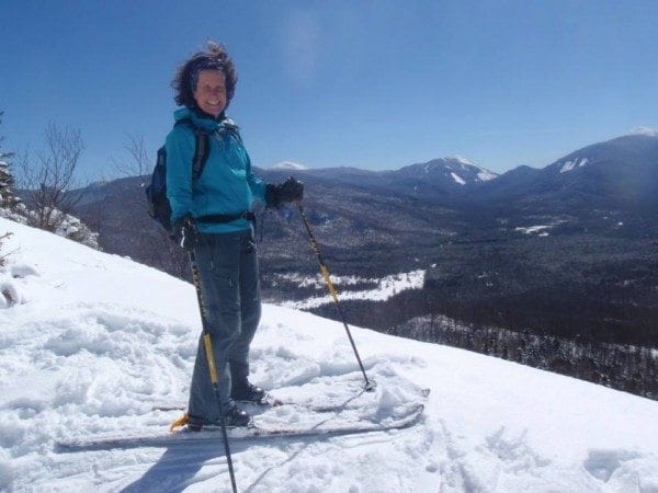 Carol MacKinnon Fox summits Mount Van Hoevenberg on skis. Photo by Phil Brown.