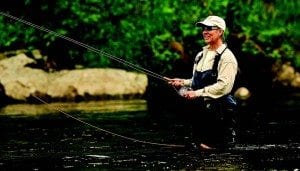 Gay Barton casts for trout in the West Branch of the Ausable. Photo by Nancie Battaglia