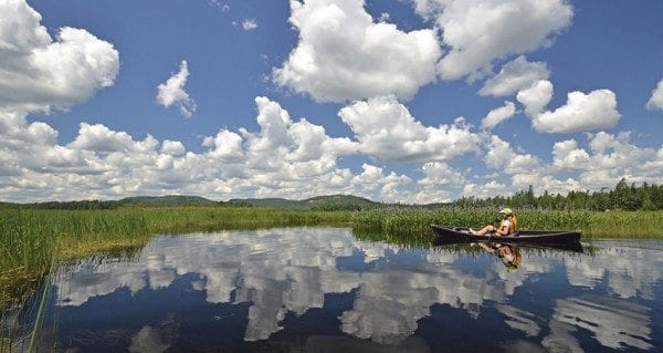 A canoeist paddles a stretch of Shingle Shanty Brook that lies within the Forest Preserve. Photo by Dan Way