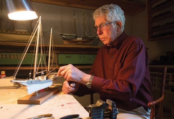 Bill Kissam crafts museum-quality models in his Westport home. Photo by Mike Lynch