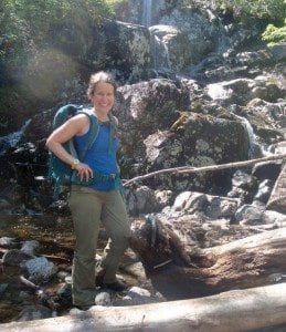 Carol Fox stops at the waterfall on MacIntyre Brook. Photo by Phil Brown