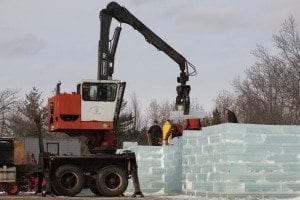 Workers scramble to build Saranac Lake’s ice palace before this year’s winter carnival. Photo by Mike Lynch