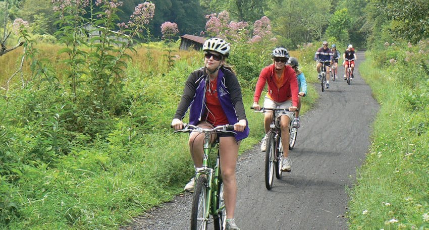 Bicyclists pedal the Virginia Creeper Rail Trail in the Blue Ridge Mountains. Photo by Richard Smith