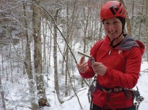 Sabrina holds an ice screw. Photo by Phil Brown