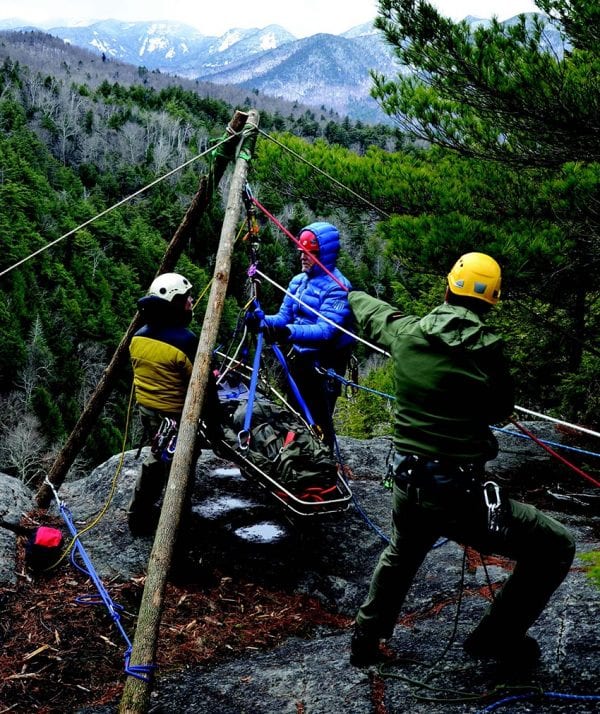 A ranger and two volunteers practice rescue techniques at a cliff near King Phillip’s Spring. PHOTO BY KEVIN MACKENZIE