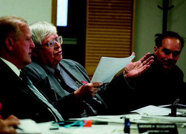 Outgoing Commissioner Dick Booth, center, with Commissioners Daniel Wilt, left and Arthur Lussi at the Adirondack Park Agency in June. PHOTO BY MIKE LYNCH