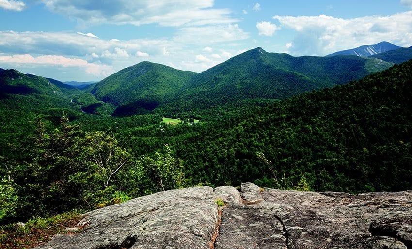 The view from the summit includes the Ausable Club with Round, Noonmark and Dix mountains in the background. PHOTO BY LISA GODFREY