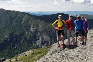 Bill Schneider, Kevin MacKenzie, Adam Crofoot, and Allison Rooney, with Panther Gorge in background. Photo by Allison Rooney.