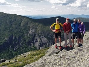 Bill Schneider, Kevin MacKenzie, Adam Crofoot, and Allison Rooney, with Panther Gorge in background. Photo by Allison Rooney.