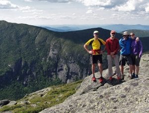 Bill Schneider, Kevin MacKenzie, Adam Crofoot, and Allison Rooney, with Panther Gorge in background. Photo by Allison Rooney.