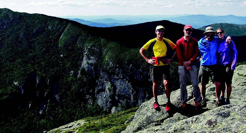 Bill Schneider, Kevin MacKenzie, Adam Crofoot, and Allison Rooney, with Panther Gorge in background. PHOTO BY ALLISON ROONEY