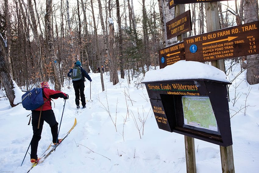 Skiers head up one of the old ski trails reopened by Steve Ovitt. PHOTO BY NANCIE BATTAGLIA