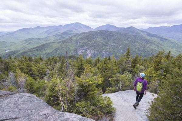 A hiker finds a moment of solitude on Giant Mountain during a busy weekend. Photo by Mike Lynch