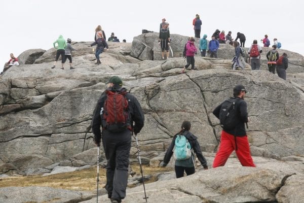 Hikers on the summit of Cascade Mountain. Photo by Mike Lynch