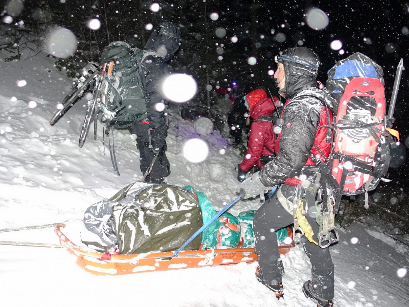 Rescuers transport the patient down Saddleback Mountain. 