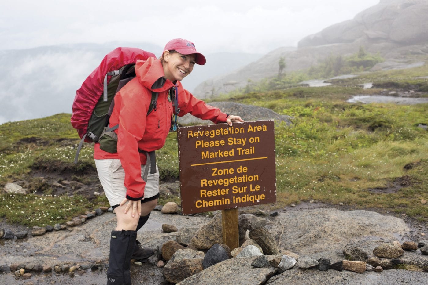 Julia Goren of Adirondack Mountain Club on the summit of Cascade Mountain. Photo by Mike Lynch