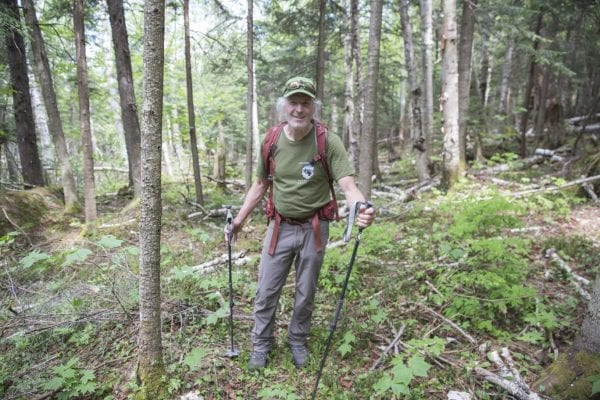 Ron Konowitz, of the Adirondack Powder Skier's Association, stands in the woods on Wright Peak in late May.
