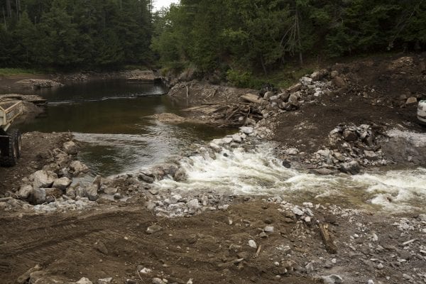 Crews work to remove the Rome Dam on the West Branch of the Ausable River on August 28, 2018. The dam is located upstream of Ausable Forks. Photo by Mike Lynch