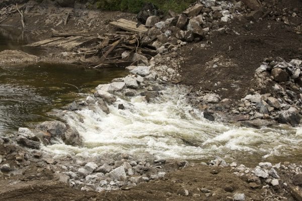 Crews work to remove the Rome Dam on the West Branch of the Ausable River on August 28, 2018. The dam is located upstream of Ausable Forks. Photo by Mike Lynch