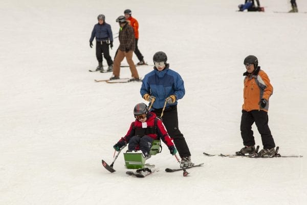 The Adaptive Winter Sports Program is one of many programs the Double H Ranch in Lake Luzerne offers children with chronic illnesses or disabilities. Photo by Mike Lynch